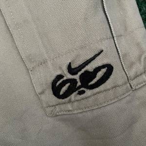 Bermuda Cargo Nike Bege
